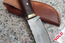 Canister Damascus Drop Point Utility Knife, Hidden tang canister damascus drop point utility knife. Hand forged from ball bearings and 01 tool steel powder. Overall length 180mm and blade length 87mm. Brass bolster with leather and steel 