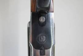 FN , Belgian, 12 Gauge side-by-side shotgun, 27
