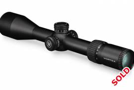 Vortex Diamondback Tactical 6-24x50 FFP, The focal plane reticle in the Vortex Diamondback Tactical 6-24x50 FFP Riflescope allows shooters to use the information-packed EBR-2C reticles for ranging, holdovers or windage corrections on any magnification. Housed inside its durable, one-piece aluminum tube is a 4x optical system delivering excellent edge-to-edge clarity and sharp resolution. Exposed elevation and windage turrets are low profile enough to stay out of the way in packing situations, but offer the quickness, ease and precision of dialing accurate shots at distance. A side adjustable parallax gives shooters peace of mind by removing parallax error from the equation from 9.1 m to infinity.
