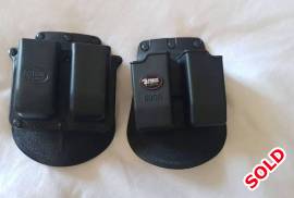 FOBUS DOUBLE MAG POUCH FOR GLOCK 9MM , Two(2)x Fobus Double Magazine pouches for Glock 9mm pistols. Model 6900. R500 for both. Postage cost for sellers account. 