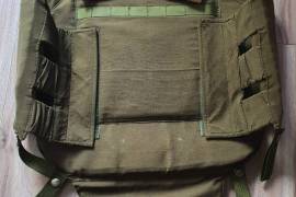 Recce Bullet Proof Vest, South African Recce, Bullet Proof Vest. Size Large, Infantry Level 2/3. With pull out shrapnel groin protection. Manufactured in 1988. Ceramic front plate by MOH-9 Pretoria, Clansman Armour Systems Ballistic level 3. Very good condition with no tears. All straps, closures and velcro in very good condition. This is a very rare piece and would be a great addition to any militaria collection or South African militaty collection. Price Negotiable