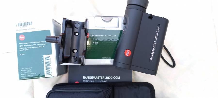 Leica 2800.com Rangefinder with Tripod Adapter, Leica 2800.com Rangefinder including a Tripod Adapter of R1700. The only better rangefinder is the new model 3000. Please do research, it is much more than just a rangefinder. It make you with your calibrated rifles deadly accurate over very long distances, uphill, downhill etc.