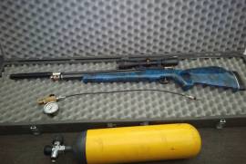Custom BAM, Custom Bam 51 with 6l 300 Bar Drager, Weihrauch HW100 fill station with 300 bar pipe, fittings and guage (worth 2.5k, the guage 1.3k alone), MMI Rifle case, Gamo 3-9x40 AO scope and 25mm medium scope mounts,, silencer by Kevin (Airvolution), fully serviced by NY Customs (recrown, polish, deburring, new seals, tune up, Hatsan style fill setup, trigger tune)  and has also had a gauge fitted with a better filling solution by them, the breech has also had a good polish so no sticky issues when loading pellets (common issue with these rifles). The stock has been custom hydro dipped in a stunning blue camo, preventing moisture damage and an extra layer of protection to the stock. This rifle shoots 8.44gr JSB at 880fps (as much power as a S510 in 5 cal), with a string count of 60 to 70 shots bringing you down till about 85 bar, and is accurate out to 100m. The rifle is worth 6k alone.

This rifle is a Chinese made rifle that is a direct copy of the Daystate Huntsman (costing in the range of 45k), one of the best and most sold PCPs in the world. The Bam is said to be copied well enough that parts are interchangeable between rifles.

Drager cylinders are highly sought after, even more so for the 300 bar ones, as they are of chrome moly composition, giving them a nearly infinite lifespan, unlike those of aluminium or steel cyliders. This cylinder was never used to dive with, and thus never exposed to water.  The cylinder on it's own is worth about 7k.

Nothing needs to be done on this rifle, just pick up and start shooting. All the kit is there, tuned and fully serviced, cylinder to top up and air station.