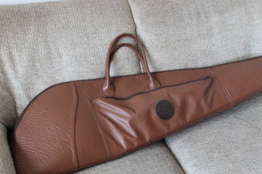 Leather Rifle Bag, Genuine leather rifle bag. Custom, hand-made with thick padding for the barrel and Velcro strips inside. Extra height to fit a rifle with a scope attached and side pouch. Has a hook to hang up and double zip to lock. Contact Gary on 0729338562 for info
 