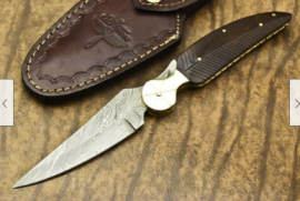 Damascus steel folding knives new in box, Damascus steel folding knives new in box with leather sheath,would make a perfect gift.