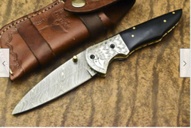 Damascus steel folding knives new in box, Damascus steel folding knives new in box with leather sheath,would make a perfect gift.
