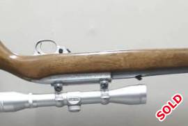 Ruger 10/22 Stainless, Ruger 10/22 Stainless with Wooden stock. Includes Simmons 4x32 scope as well as 10 round rotary mag and 25 round extended mag.