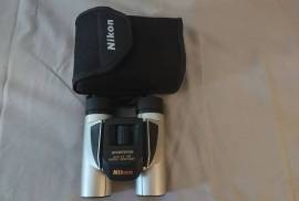 NIKON 8x25 Compact Binoculars,  NIKON 8x25 compact binoculars in Like New condition!  Excellent clarity! Come with original pouch, lens cloth and strap. Genuine Nikon JAPAN optics at a fraction of the price of similar class European ones..Folding to minimal size, they fit perfect in a shirt pocket. Great in the car for that 