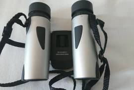 NIKON 8x25 Compact Binoculars,  NIKON 8x25 compact binoculars in Like New condition!  Excellent clarity! Come with original pouch, lens cloth and strap. Genuine Nikon JAPAN optics at a fraction of the price of similar class European ones..Folding to minimal size, they fit perfect in a shirt pocket. Great in the car for that 