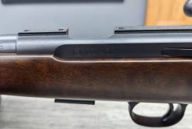 CZ 457 .22LR LUX, A traditional European hunting rifle design in a rimfire configuration. The Turkish walnut cheekpiece and varnished stock are of superior quality, with checkering etched by laser. Conventional iron sights are included as standard.