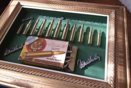 Weatherby cartridge collection., Weatherby, a name mentioned often around the campfire with respect and envy!  This collection has 11 Weatherby classic calibers mounted in it. All deactivated so no permit is required. Calibers include  224; 270;  300;  378;  416;  460;  338-378;  340;  30-378;  7mm;  240.  The 460 Weatherby  Mag was the most powerful shoulder fired cartridge in the world including the mighty 600 Nitro  until the advent of the 700 Nitro. The ammo box in this collectioon is going for R600 on EBAY alone (empty). These are original cartridges not fake dummy rounds. Set in a classic gold wooden vintage frame. You wont find another like it! The photos don't do it justice. For the collector who almost has everything in their mancave. Try find another one like it?? Trevor .
 