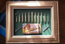 Weatherby cartridge collection, Weatherby, a name mentioned often around the campfire with respect and envy!  This collection has 11 Weatherby classic calibers mounted in it. All deactivated so no permit is required. Calibers include  224; 270;  300;  378;  416;  460;  338-378;  340;  30-378;  7mm;  240.  The 460 Weatherby  Mag was the most powerful shoulder fired cartridge in the world including the mighty 600 Nitro  until the advent of the 700 Nitro. The ammo box in this collection is going for R600 on EBAY alone (empty). These are original cartridges not fake dummy rounds. Set in a classic gold wooden vintage frame. You wont find another like it! The photos don't do it justice. For the collector who almost has everything in their mancave. Try find another one like it?? Trevor .
 