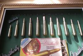 Weatherby cartridge collection, Weatherby, a name mentioned often around the campfire with respect and envy!  This collection has 11 Weatherby classic calibers mounted in it. All deactivated so no permit is required. Calibers include  224; 270;  300;  378;  416;  460;  338-378;  340;  30-378;  7mm;  240.  The 460 Weatherby  Mag was the most powerful shoulder fired cartridge in the world including the mighty 600 Nitro  until the advent of the 700 Nitro. The ammo box in this collection is going for R600 on EBAY alone (empty). These are original cartridges not fake dummy rounds. Set in a classic gold wooden vintage frame. You wont find another like it! The photos don't do it justice. For the collector who almost has everything in their mancave. Try find another one like it?? Trevor .
 