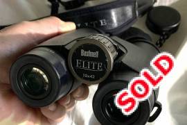Bushnell’s top-of-the-range series, the Elite , New price about R9000.00, all photos are of the actual one for sale.

Bright. Clear. HD Imagery. Already a 60+ year masterwork of ruggedness, clarity and light transmission, the Elite has ED Prime glass and RainGuard HD anti-fog technology. Fully multi-coated and featuring XTR technology, the Advanced Fusion Hybrid Lens system delivers 99.7% light transmission per lens. The result is unmatched edge-to-edge clarity, contrast and color-true imagery - now pushed to the highest levels with the use of ED Prime Glass. RainGuard HD coating eliminates lens fogging, boosts brightness and scatters moisture even faster than original RainGuard. Elite binoculars are also 100% waterproof,* fogproof and built around a tough, lightweight magnesium chassis for reliability in the most extreme conditions..
