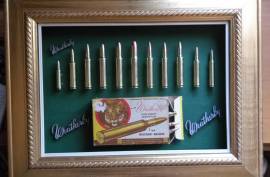 Weatherby cartridge collection, Weatherby, a name mentioned often around the campfire with respect and envy!  This collection has 11 Weatherby classic calibres mounted in it. All deactivated so no permit is required. Calibres include  224; 270;  300;  378;  416;  460;  338-378;  340;  30-378;  7mm;  240.  The 460 Weatherby  Mag was the most powerful shoulder fired cartridge in the world including the mighty 600 Nitro  until the advent of the 700 Nitro. The ammo box in this collectioon is going for R600 on EBAY alone (empty). These are original cartridges not fake dummy rounds. Set in a classic gold wooden vintage frame. You wont find another like it! The photos don't do it justice. For the collector who almost has everything in their mancave. Try find another one like it?? Trevor .