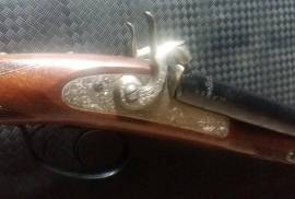 Blackpowder double rifle, This double rifle was bought many years back and never used since, it has been kept clean and rust free. It has been drilled for a scope mount, and to the best of my knowledge has fired 4 shots from each barrel. It comes with all its parafanalia and loading equipment.
 