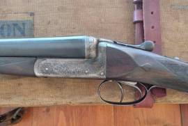 Shotgun for sale, Gun beautifully and professionally restored by Alan Henry. With original case and the 3 gun rifle safe.