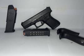 Glock G19, TECHNICAL DATA
Caliber - 9x19mm
System - Safe Action®
Mag. Capacity Standard: 15
Optional: 17 / 10 / 24
Barrel Length - 102 mm | 4.02 inch
Weight without magazine - 610 g | 21.52 oz
Weight with empty magazine - 670 g | 23.63 oz
Weight with loaded magazine - 855 g | 30.16 oz
Trigger Pull - 26 N

DIMENSION

	
		
			1
			Length (Overall)**
			185 mm | 7.28 inch
		
		
			2
			Slide Length
			174 mm | 6.85 inch
		
		
			3
			Width (Overall)
			34 mm | 1.34 inch
		
		
			4
			Slide Width
			25,5 mm | 1.00 inch
		
		
			5
			Height incl.Mag.
			128 mm | 5.04 inch
		
		
			6
			Line of Sight (Polymer)
			153 mm | 6.02 inch
		
		
			
			Line of Sight (Steel)
			152 mm | 5.98 inch
		
		
			
			Line of Sight (GNS)
			151 mm | 5.94 inch
		
		
			7
			Trigger Distance**
			70 mm | 2.76 inch
		
	

