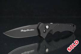 Benchmade 13800SBK Harley Davidson Nonconformist, Awesome and rare benchmade non conformist, this is an auto knife with a very fast action

there is some signs of wear on the handle and some paint loss on the blade