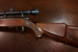 SAKO .22 Long Rifle, Complete with TASCO 10x40 scope, oil stock, silencer, perfect condition