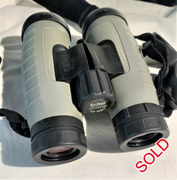 Bushnell 10x42 NatureView Roof Binocular, he 10x42 NatureView Roof Binocular from Bushnell has a lead-free optical path that is fully multicoated for enhanced contrast and image clarity. This model of the NatureView series binocular uses a roof prism design, which enables a more streamlined form factor compared to Porro prism designs. The binocular weighs less than 1.5 lbs and features a rubber-armored weather-sealed housing, making it well-suited for day hikes and other recreational activities. Twist-up eyecups and 15mm eye relief permit a comfortable viewing distance even while wearing eyeglasses. A 62° apparent viewing angle provides immersive views, making the 10x42 NatureView a well-equipped binocular for almost any mid-range observation.