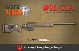 RUGER HAWKEYE LONG RANGE TARGET 6.5 PRC, True to the Ruger Brand, the designers have come up with a great long range solution in the legendary Hawkeye range. The Ruger Hawkeye Long Range Target 6.5 PRC was designed with the more traditional shooter in mind. The adjustable stock, matte finish, muzzle brake, heavy barrel and detachable box magazine all combine to look like a dedicated sniper rifle. The new LRT rifle incorporates Ruger’s non-rotating claw extractor action and fixed ejector into a dedicated long-range shooting platform. The Ruger Hawkeye LRT 6.5 PRC comes equipped with a 26-inch free-floated cold hammer-forged 4140 chrome-moly steel barrel with a heavy profile and a 5/8×24 threaded muzzle. The LRT has a high-quality brown laminate stock and features black epoxy resin texturing over the entire length. The broad beavertail fore-end comes with a flat M-Lok rail for mounting accessories like bipods. Chambered in the best long range calibers, the Ruger Hawkeye Long Range Target will be a great rifle, off the shelf with custom features and matching precision.