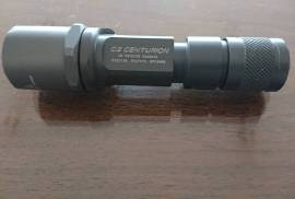 SURFIRE C2 CENTURION Combat flashlight!, RARE, since long discontinued, in AS NEW condition, the iconic compact tactical flashlight of the Great SURFIRE brand. Proven its rugdness in battlefields worldwide, has been for long-together with the M951-the classic choice of USMC. Simply indestructible, in grey mil spec hard anodized colour. Operates with just two 3V (123A) batteries. Made in USA. Bright, Powerful & Compact!! Perfect on you, in your car, on your weapon or simply with your home defence setup. Not many of these lights around anymore...