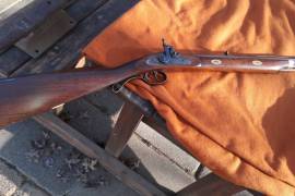 HAWKEN RIFLE, HAWKEN SANTA FE RIFLE,MADE BY UBERTI, ,A REAL COLLECTORS ITEM COPPIED FROM THE ORIGINAL KID CARSON HAWEN RIFLE.ALL METAL HARDEWARE.BROWNED BARREL. IN VERY GOOD CONDISION,AND WELL LOOKED AFTER.