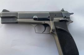 BROWNING HI-POWER 9MM PARABELLUM PISTOL, Belgian manufactured 9mm para 13-shot single action pistol . The pistol has been customised and includes the following ; high profile sights, stippling of upper on the slide, extended safety, squared and ruled trigger guard, accurised trigger, extended magazine release, bevelled magazine well, perplexed frame and Pachmayr Signature rubber grips. The pistol in in very good condition.


