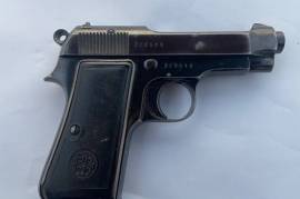 BERETTA MOD.34 9mm SHORT PISTOL (BLUED FINISH), Italian manufactured 9mm Short 7-shot single-action pistol. Blued original finish and grips, shows holster wear.


