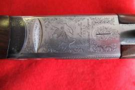 BERETTA 687EELL SHOTGUN, 12 BORE BERETTA 687 EELL OVER & UNDER. 3O INCH BARRELS. CHOKED 1/4 AND 1/2. LEATHER SLIP. USED BUT IN EXCELLENT CONDITION.ENGRAVED.SUPERB WOOD.TOP OF THE LINE MODEL OF THE FAMED 680-SERIES SHOTGUNS.NEW PRICE WILL BE APPROXIMATELY R160 000.00. GOOD INVESTMENT.