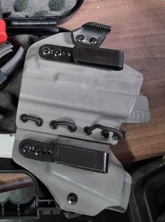 Glock 19 - IWB Holster with Lightbearing, This is a Glock 19 IWB Holster with lightbearing. The lightbearing is for a Olight PL Mini 2. Hostler is grey in colour and is used and in good condition with no cracks. Whatsapp only
