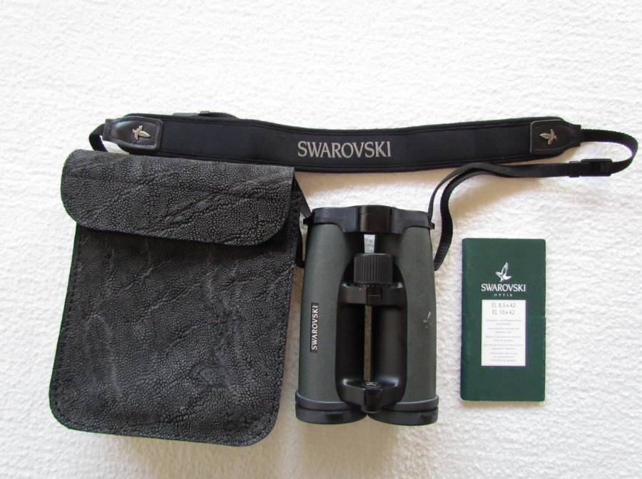 Swarovski Binoculars, Model EL 8.5 x 42 WB in custom made leather case.  As new.  Hardly been used.  Comes with original strap.
 