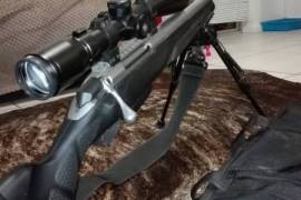 25-06 Tikka T3 SuperVarmint, 25-06 Tikka T3 SuperVarmint stainless steel bull barrel. Synthetic stock with adjustable cheek piece. Lynx 3-12x56 with illuminated recticle
Bushman silencer
Bipod
Gunbag and sling