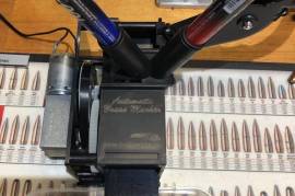 Automatic Brass / Ammunition Color Marker, It will stripe your loaded ammo with one or two lines around the full circumference of the case, while you are reloading your ammo, affectively costing you no time at all!