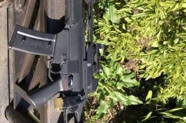 WE G36c AEG Airsoft rifle+accessories, A lightly used WE G36c, includes one high capacity magazine, two medium capacity magazines, a sling, red dot sight, battery and charger. No box. 