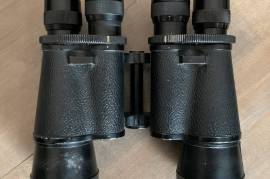 Incredibly Rare Japanese vintage Binoculars, Marked: Variable 8X. 12X, Atlas Coated, Field 8X 6,5° 12X 5°, 50mm.

Opticis clear.

Atlas brand “Revolver” type binoculars this brand was named for the Greek god Atlas, the Titan who supported the heavens on his shoulders. Those rather quirky post war selectable eyepiece 8x and 12x combined Atlas binoculars were modeled after the 1896 Zeiss Marine Glas Mit Revolver, made famous by being used by Admiral Togo on the battleship Mikasa during the 1905 Battle of Tsushima (right). Though Zeiss only made that model from 1896 to 1906, the fact that it is so well known which particular binoculars were used in a particular battle 109 years ago underscores the intertwined relationships between binoculars and militarism.

