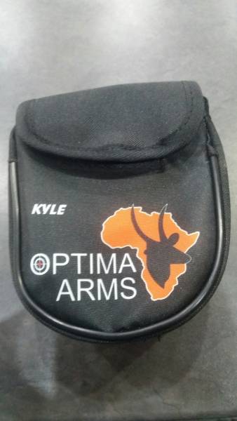 Optima Arms Earmuff Pouch, Locally manufactured from quality materials, these handy earmuff pouches will keep your ear protection safe, secure and easily accesable without the need to drape them around your neck. Available in the standard Optima branded format @R100 each or if you want something special you could have your or someone elses name printed on them, there are also a variety of colour options available. Please note that custom pouches are sold @R120+
depending on the materials requested and have a lead time of 3 working days.