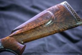 Rare burl walnut Jock Wolmarans custom 6mm, Beautifully crafted by Jock Wolmarans in the 1980s from hard to find burl walnut, engraved and etched on side plates. One of the last rifles made by this master craftsman. Rifle is impeccable, never been shot. Sold with ammo. Larger photos on request. Please make an offer.