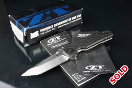 Zero Tolerance 0620CF Tanto Knife Carbon Fiber (3.,  The knife is in user condition and has some scratches on the blade as seen in the last image

The action is exceptionally smooth

Comes with it's original box and paperwork, the box is a bit damaged
