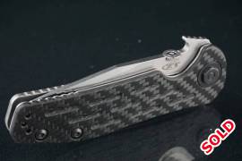 Zero Tolerance 0620CF Tanto Knife Carbon Fiber (3.,  The knife is in user condition and has some scratches on the blade as seen in the last image

The action is exceptionally smooth

Comes with it's original box and paperwork, the box is a bit damaged
