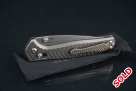 Benchmade 781S Anthem AXIS Lock Folding Knife Bron, The knife is in mint unused condition has had some pocket time but not much

comes with it's benchmade pouch only

The first integral handle knife from benchmade and the action is amazingly smooth
