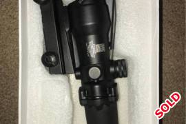 Acog scope, I ordered this online, not going to use it any more.  The cross hair illuminates with the fibre at the top of the scope.  