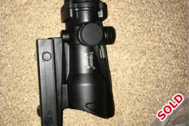Acog scope, I ordered this online, not going to use it any more.  The cross hair illuminates with the fibre at the top of the scope.  