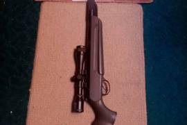 Springer Air rifle, Hatsan Mod 70 with quattro trigger, Nikko Stirling 4X32 airgun scope, original synthetic stock, pellets and bag, very little used. 
