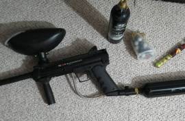 BT4 Combat Paintball Gun, BT4 Combat Paintball Gun with 2 canisters, 1 large hopper, 1 small hopper, nylon balls and pepper balls.  The gun is in excellent condition.  Great for self defense.