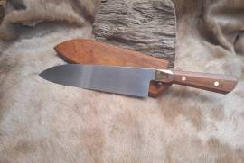 210mm Hand forged carbon steel chef knife, Hand forged from 52100 carbon steel, 210mm blade, octagonal Rosewood handle, brass and copper bolster, brass Corbie fasteners. Comes with a matching Rosewood sheath.
Specifications
Steel: 52100
Blade length: 210mm
OA length: 335mm
Width: 50mm
Thickness: 3.5mm at heel, 1.5mm 1” from tip
Made in the Republic of South Africa
ZAR4800