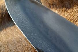 220mm Curly Birch Chef knife, 220mm Hand forged chef knife for sale. Blade is forged out of 52100 carbon steel with a Curly Birch handle, black G10 lines and bolster with brass pins.
Specs:
OA length: 330mm
Blade: 220mm 
Handle material: Curly Birch, G10 bolster and liner, brass pins.
Blade thickness: 5mm at heel, 2mm 1