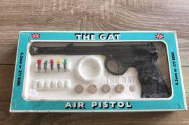 "The Gat" - Highly Collectible 100% good, You simply do not find this Icon of an air gun in this condition anymore. VERY rare indeed and to top it off, it still fires perfectly. Comes in its original box with corks and darts. Some of the darts are missing.. But to still have the original packaging definately is rare and adds value..
For any collector, this is a great addition or for any enthusiast, a pleasure to own.. Dont miss it. You wont see this again  I recon..