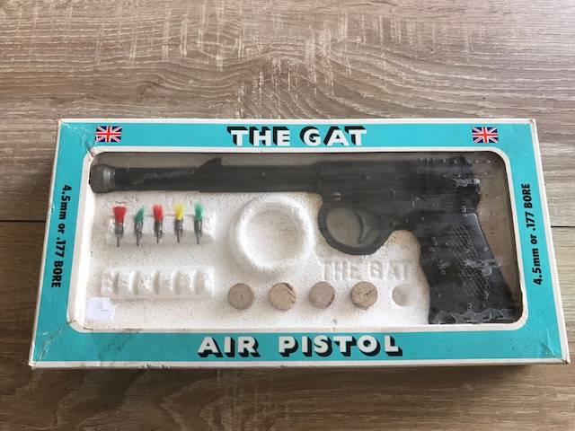 "The Gat" - Highly Collectible 100% good, You simply do not find this Icon of an air gun in this condition anymore. VERY rare indeed and to top it off, it still fires perfectly. Comes in its original box with corks and darts. Some of the darts are missing.. But to still have the original packaging definately is rare and adds value..
For any collector, this is a great addition or for any enthusiast, a pleasure to own.. Dont miss it. You wont see this again  I recon..